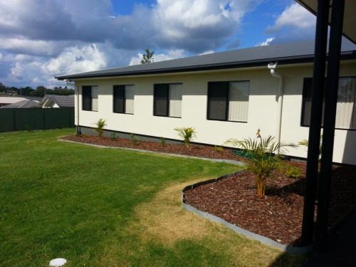 The We Care centre building and gardens in Redbank Plains