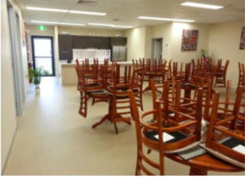 Dining hall set up with tables and chairs